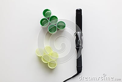 Curling iron or hot styler and hair curlers Stock Photo
