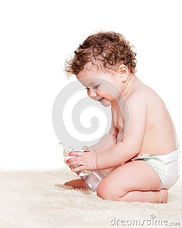 Curly baby in diaper Stock Photo