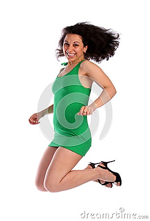 Curly-headed girl jumping Stock Photo