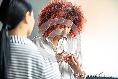 Curly stressed woman reading description of antidepressants Stock Photo