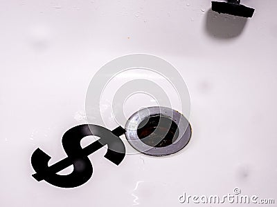 Currency Down The Plughole Stock Photo