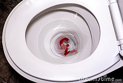 Currency Down The Toilet Stock Photo
