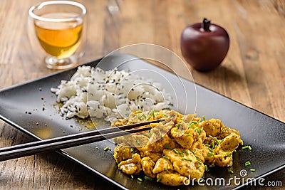 Curry chicken and oriental rice in a dish Stock Photo