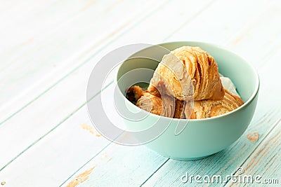 Curry puff pastry in cyan vintage bowl put on old table with copy-space Stock Photo