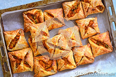 Curry puffs-Vegetarian puff pastry in baking tray Stock Photo