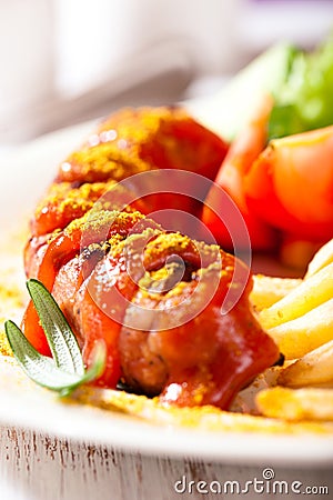 Currywurst with french fries Stock Photo