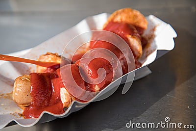 Currywurst a typical German street food grilled and sliced sausage with curry ketchup Stock Photo