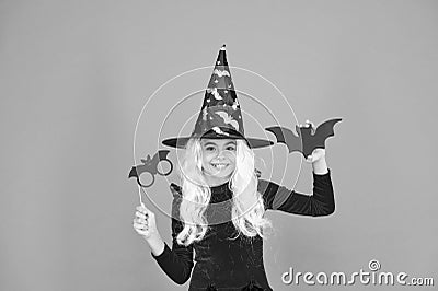 Curse spell. Little girl cast magic spell orange background. Wicked witch spell. Magic and witchcraft with spell and Stock Photo