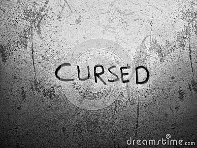 cursed word written in rough style on the lite grey background Stock Photo