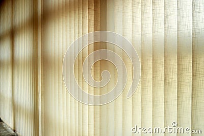 Curtains with adjustable vertical slats made of fireproof fabric to regulate ambient light Stock Photo