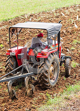 Curtorim, Goa/India- May 22 2020: Tractor and tiller, plower used in agriculture Machinery used in the field for cultivation Editorial Stock Photo
