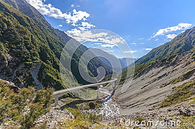 Curve pathway road bridge to the mountain New Zealand Stock Photo