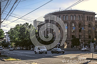 Curved building in the classical style of pink tuff at the intersection of Agatangeghos and Movses Khorenatsi in the city of Yere Editorial Stock Photo