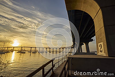 Curved Coronado Bridge at sunrise over San Diego Bay Stock Photo