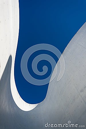 Low angle view of Curved detail and shadow of concrete with beautiful blue sky Editorial Stock Photo