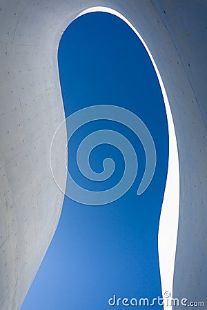 Low angle view of Curved detail and shadow of concrete with beautiful blue sky Editorial Stock Photo