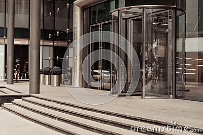 Curved doorway to the office, bank, corporation. Glass and metal doors. Stock Photo