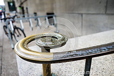 Curved metal handrail on an outdoor staircase Stock Photo