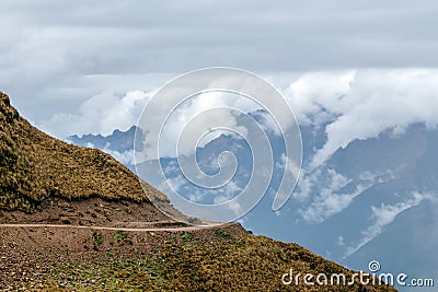 Curved mountain road in misty mountains, Abra Mariano Llamoja, pass between Yanama and Totora, The Choquequirao trek, Peru Stock Photo