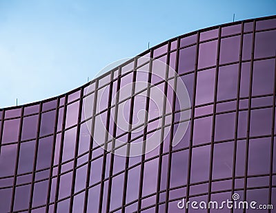 Curved Office building with pink glass Stock Photo