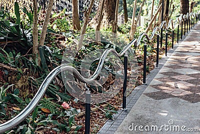 Curved rail near Malaysia national mosque - Kuala Lumpur. Stock Photo