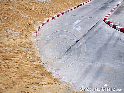 Curved Road with Unfinished Footpath Construction Stock Photo