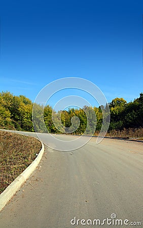Curved road uphill Stock Photo