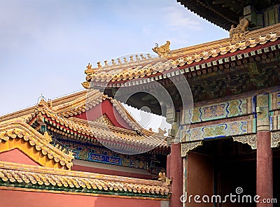 Curved roofs with gold patterns in traditional Chinese style with ceramic figures. The Imperial Palace Stock Photo