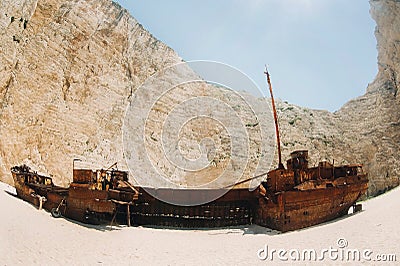 Curved ship on Zakynthos island, Greece Navagio beach, or shipwreck beach,sometimes called smugglers ` Bay , on the coast of Stock Photo