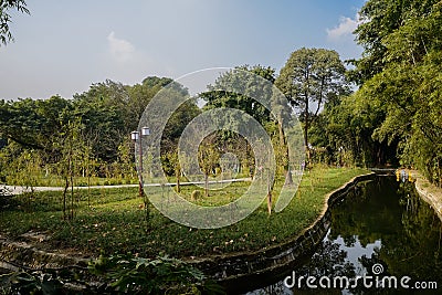 Curving path along rivulet in sunny winter afternoon,Chengdu Stock Photo