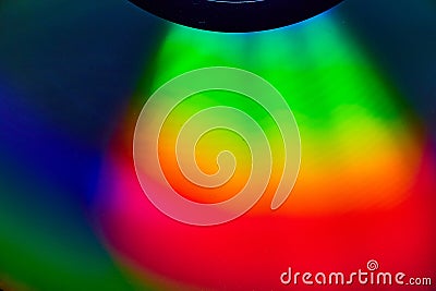 Curving rainbow colored light on dark background asset Stock Photo