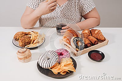 Curvy female preparing to eat hamburger, overeating problem, depression Stock Photo