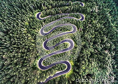 Curvy road from the high mountain pass in Transfagarasan, Romania. Stock Photo