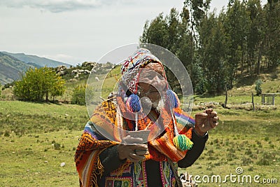 Cusco, PerÃº; December 20, 2018, native man, Peruvian elder, in ritual to coca Editorial Stock Photo