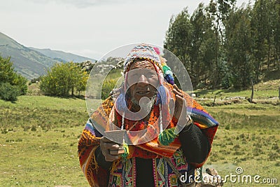 Cusco, PerÃº; December 20, 2018, native man, Peruvian elder, in ritual to coca Editorial Stock Photo