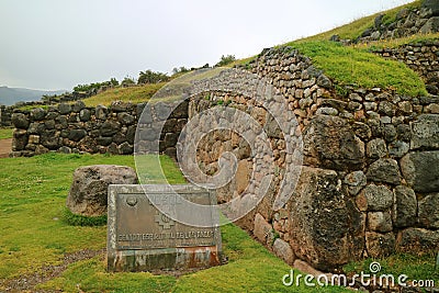 CUSCO SPIRITUAL CENTER OF THE ANDES, is what written on the brass sign plate at the ancient citadel of Sacsayhuaman, Cusco Editorial Stock Photo