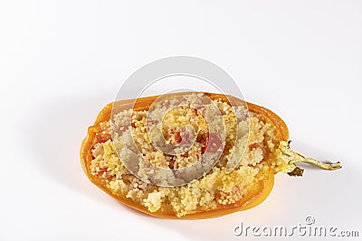 Cuscus, oven-roasted yellow pepper stuffed with couscous with vegetables Stock Photo