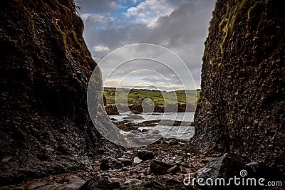 Cushendun Cave in Northern Ireland, county of Antrim, which was used as a filming location in Game of Thrones TS series Stock Photo