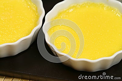 Custard cream in ramekins Stock Photo