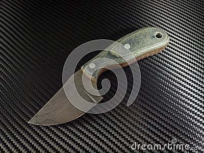 Custom hand forged knife with jeans micarta handles Stock Photo