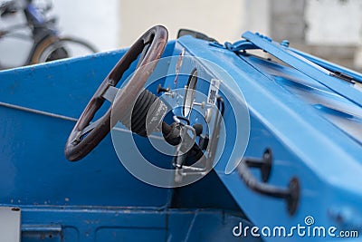 Custom made blue convertible car dashboard with wooden steering Stock Photo