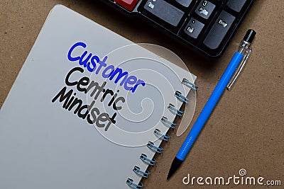 Customer Centric Mindset write on a book isolated on Office Desk Stock Photo