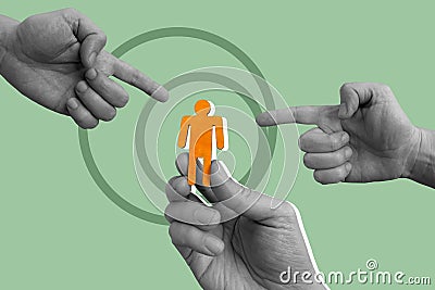 Customer centricity concept. The hand is holding the figurine. Other hands point to her. Stock Photo