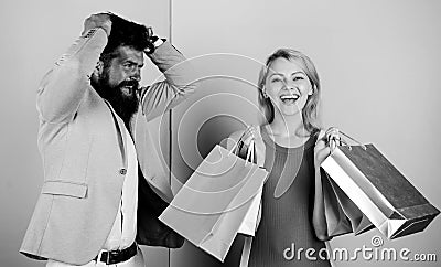 Customer decision. man angry woman shopaholic. gift packages for holiday preparation. seasonal discount. black friday Stock Photo