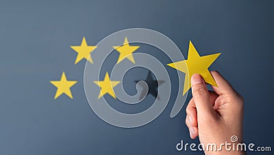 Customer Experience Concept, Best Excellent Services for Satisfaction present by Hand of Client giving a Five Star Rating Stock Photo