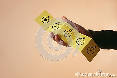 Customer Experience Concept. Happy Client giving Positive Review on Fold Paper. Feedback icon from Poor to Excellent for Products Stock Photo