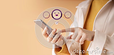 Customer Experience Concept. Happy Client Using Smartphone to Submit Rating for Online Satisfaction Surveys. Positive Review Stock Photo