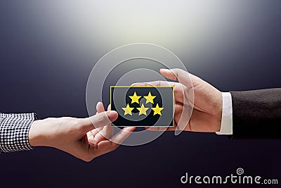 Customer Experience Concept, Happy Client Woman giving a Feedback with Five Star Rating on Card into a Hand of Businessman Stock Photo