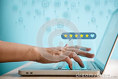 Customer Experiences Concept. Happy Client Using Computer Laptop to Giving Best Excellent Review Rating Stock Photo