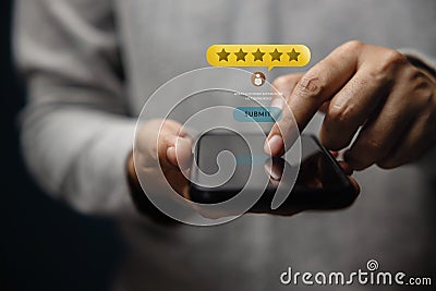 Customer Experiences Concept. Happy Client Using Smartphone to Submit Five Star Review Rating for Online Satisfaction Surveys. Stock Photo